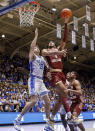 Boston College's T.J. Bickerstaff (1) attempts a shot as Duke's Ryan Young (15) defends during the first half of an NCAA college basketball game in Durham, N.C., Saturday, Dec. 3, 2022. (AP Photo/Ben McKeown)