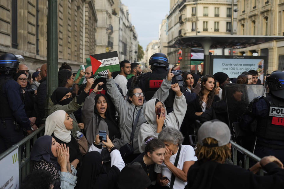 Protestors chant slogans during a rally in solidarity with the Palestinian people in Gaza, in Paris, Thursday, Oct.12, 2023. (AP Photo/Thibault Camus)