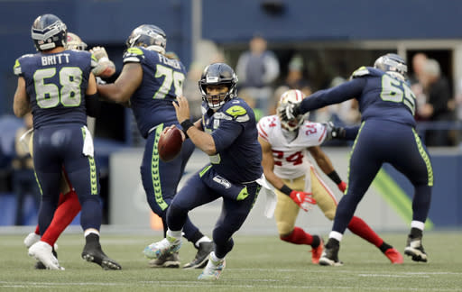 Seattle Seahawks quarterback Russell Wilson does not care about your touchdown regression worries. (AP Photo/John Froschauer)