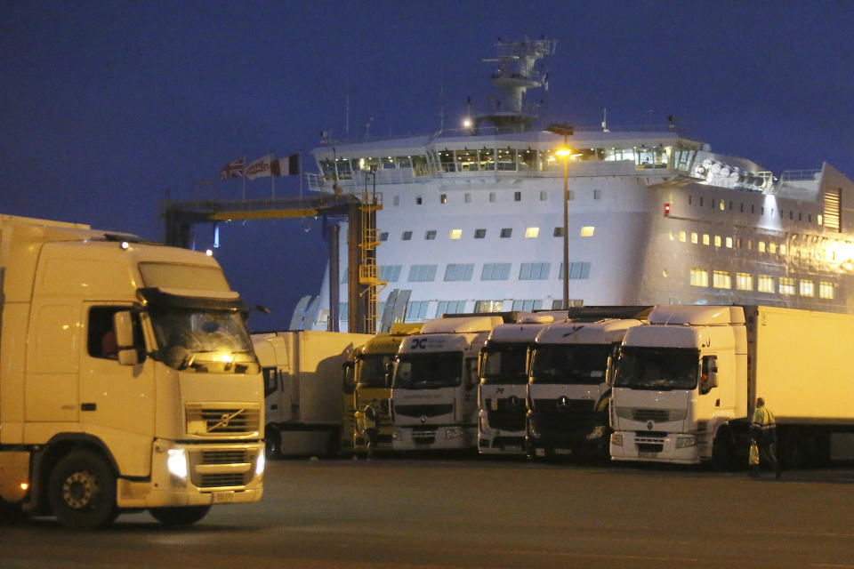 Trucks park as a ferry coming from Britain's port of Portsmouth docks at the transit zone at the port of Ouistreham, Normandy, Thursday, Sept.12, 2019. France has trained 600 new customs officers and built extra parking lots arounds its ports to hold vehicles that will have to go through extra checks if there is no agreement ahead of Britain's exit from the EU, currently scheduled on Oct. 31. (AP Photo/David Vincent)