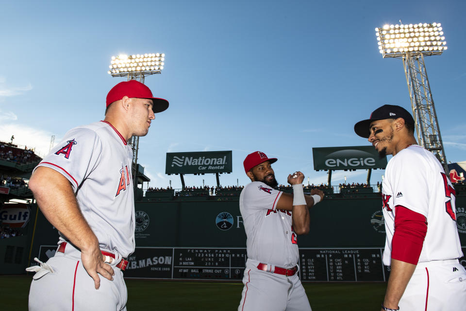 BOSTON, MA – JUNE 26: Mike Trout #27 and Chris Young #24 of the Los Angeles Angels of Anaheim talk with Mookie Betts #50 of the Boston Red Sox before a game on June 26, 2018 at Fenway Park in Boston, Massachusetts. (Photo by Billie Weiss/Boston Red Sox/Getty Images)