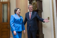 House Speaker Kevin McCarthy of Calif., right, arrives with Rep. Jennifer McClellan, D-Va., for a ceremonial swearing-in on Capitol Hill, Tuesday, March 7, 2023, in Washington. (AP Photo/Alex Brandon)