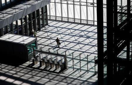 A visitor walks in the main entrance hall of new NATO headquarters during the move to the new building, in Brussels, Belgium April 19, 2018. REUTERS/Yves Herman