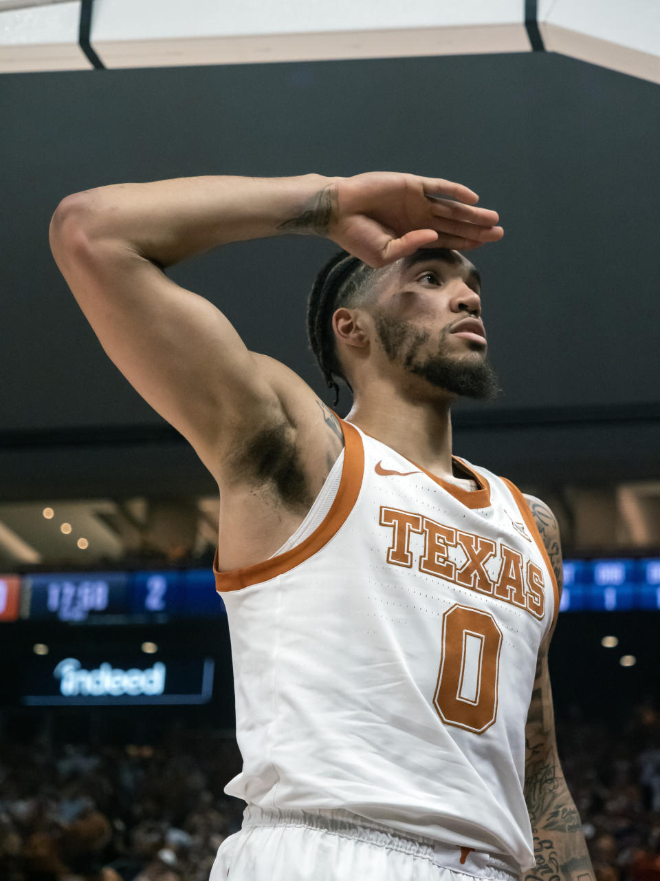 Texas forward Timmy Allen salutes the crowd after making a basket during the first half the team's NCAA college basketball game against UTEP, Monday, Nov. 7, 2022, in Austin, Texas. (AP Photo/Michael Thomas)