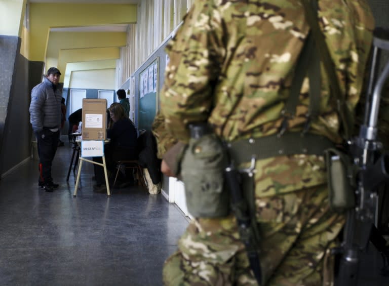 A soldier guards a polling station during primary elections in Rio Gallegos, Argentina, on August 9, 2015