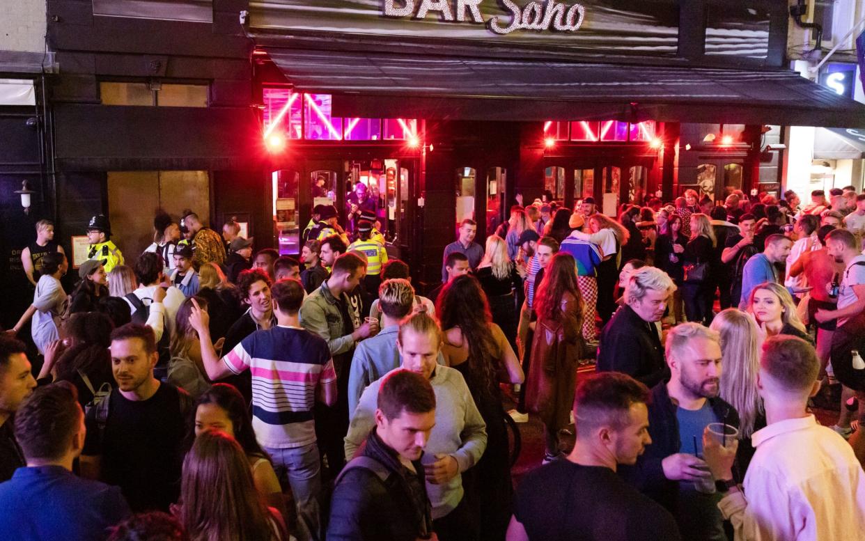 Pub-goers outside a venue in Soho on "super Saturday" - Shutterstock 