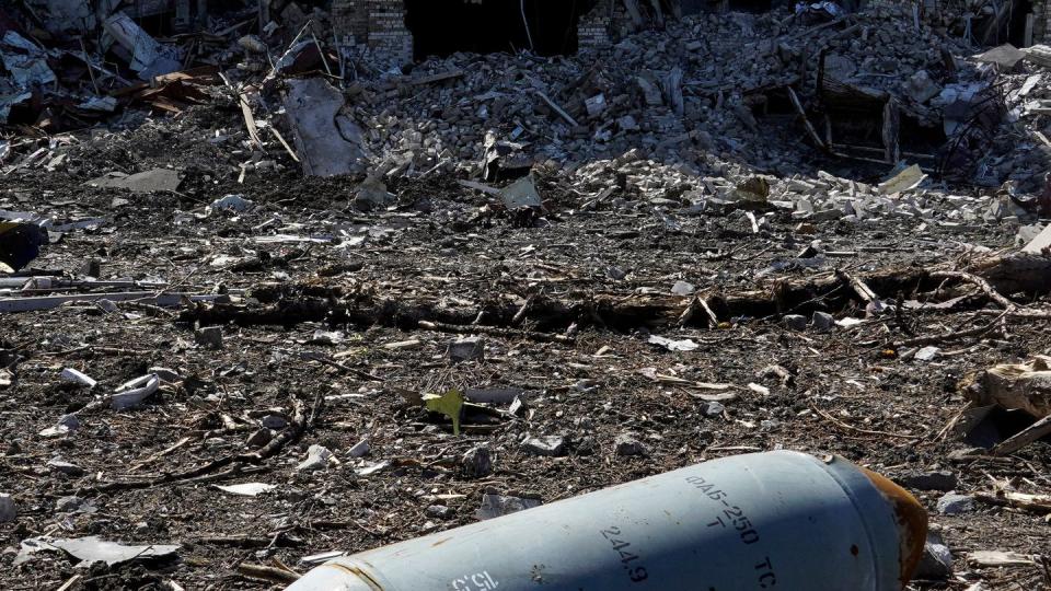 An unexploded FAB-250 bomb is seen near a destroyed building in the Ukrainian city of Mariupol on June 2, 2022. (STRINGER/AFP via Getty Images)