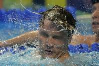 Bobby Finke reacts after winning the men's 1500 freestyle during wave 2 of the U.S. Olympic Swim Trials on Sunday, June 20, 2021, in Omaha, Neb. (AP Photo/Charlie Neibergall)