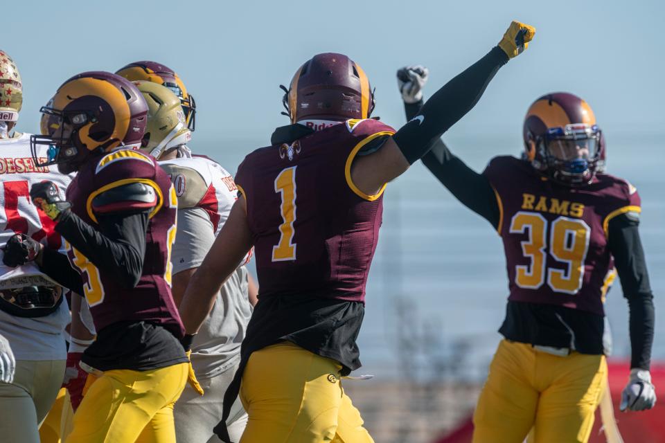 Victor Valley College’s Adrian Rodriguez and teammates celebrate after a defensive stop against College of the Desert on Saturday, Nov. 12, 2022.