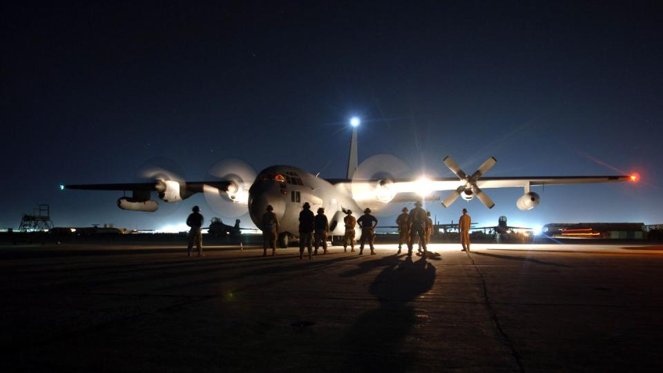 Maintainers at Bagram Air Base, Afghanistan, stand by as the aircrew starts the engines on an EC-130H Compass Call's. The aircraft is assigned to the 41st Expeditionary Electronic Combat Squadron. The Compass Call is an airborne tactical weapon system used to deny, degrade and disrupt the enemy’s ability to communicate.  Since April 2004, 41st EECS EC-130s have flown more than 700 combat sorties supporting ground forces in Operation Enduring Freedom.  (U.S. Air Force photo/Capt. James H. Cunningham)
