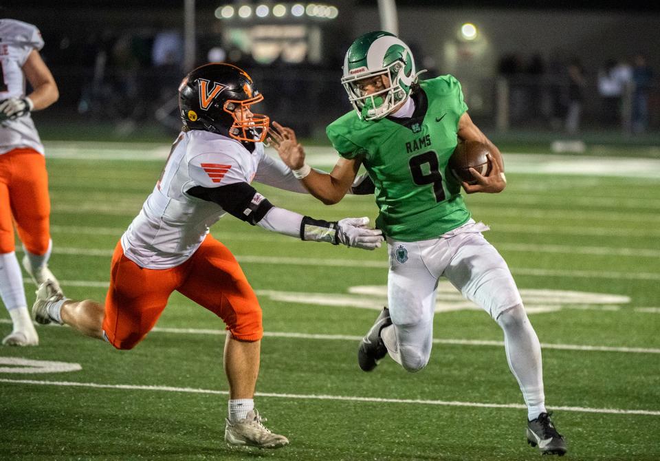 St. Mary's Samson Hunkin, right, is tries to evade Vacaville's Justin Albrecht during a Sac-Joaquin Section Div. 2 football quarterfinal game at St. Mary's Sanguinetti Field in Stockton on Nov. 10, 2023. St. Mary's won 38-0.
