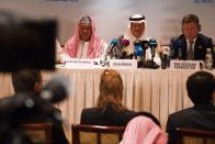 OPEC Secretary-General Mohammed Barkindo, left, Saudi Energy Minister Prince Abdulaziz bin Salman, center, and Russian Energy Minister Alexander Novak, attend a news conference after an OPEC meeting in Abu Dhabi, United Arab Emirates, Thursday, Sept. 12, 2019. OPEC's Joint Ministerial Monitoring Committee met Thursday in Abu Dhabi as estimates of lowered crude oil demand in 2020 have the cartel considering additional production cuts. Before the meeting started, Prince Abdulaziz again called for "cohesiveness" in OPEC. (AP Photo/Jon Gambrell)