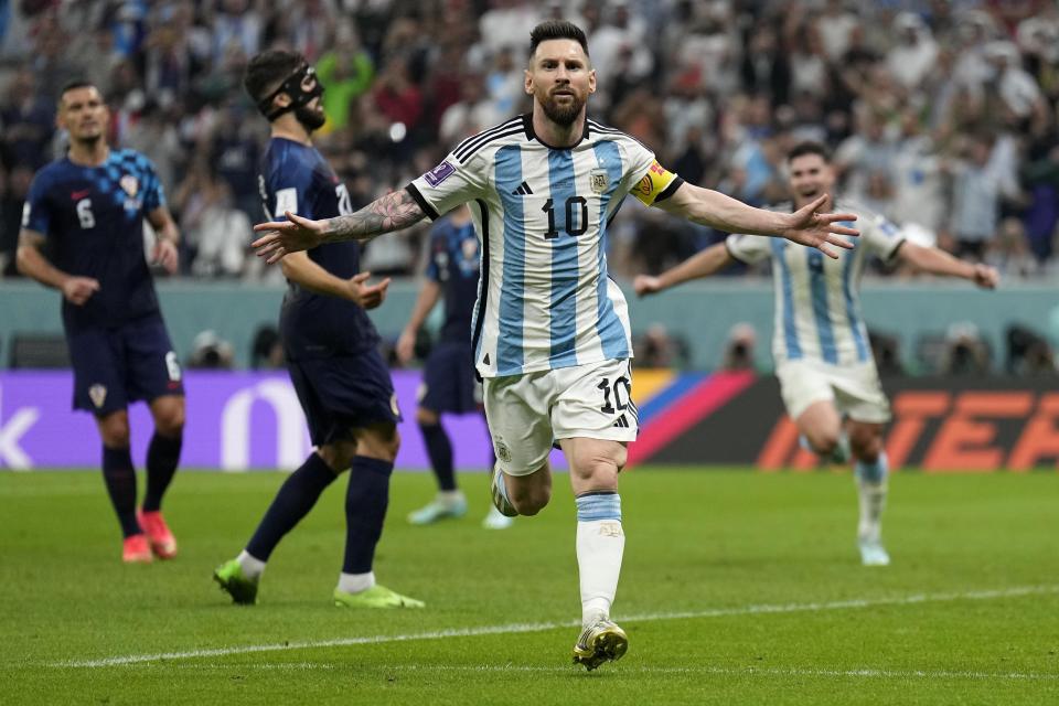 Argentina's Lionel Messi celebrates after scoring his side's first goal during the World Cup semifinal soccer match between Argentina and Croatia at the Lusail Stadium in Lusail, Qatar, Tuesday, Dec. 13, 2022. (AP Photo/Martin Meissner)