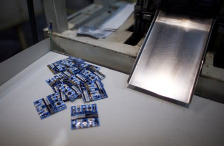 Packed condoms with words reading "always use it" are seen in a factory in Buenos Aires