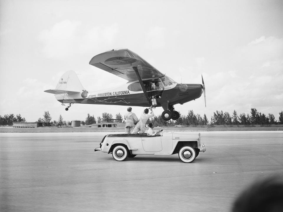 A plane is re-fuelled mid-flight as it tries to break the flying endurance record