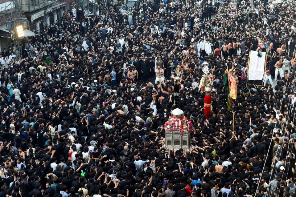 Shiite Muslim devotees take part in a procession to commemorate the death anniversary of Prophet Mohammad's companion and son-in-law Imam Ali.