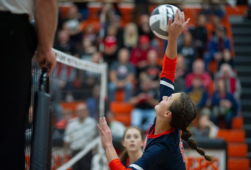 Galion's Ashley Dyer reaches up to hit a ball.