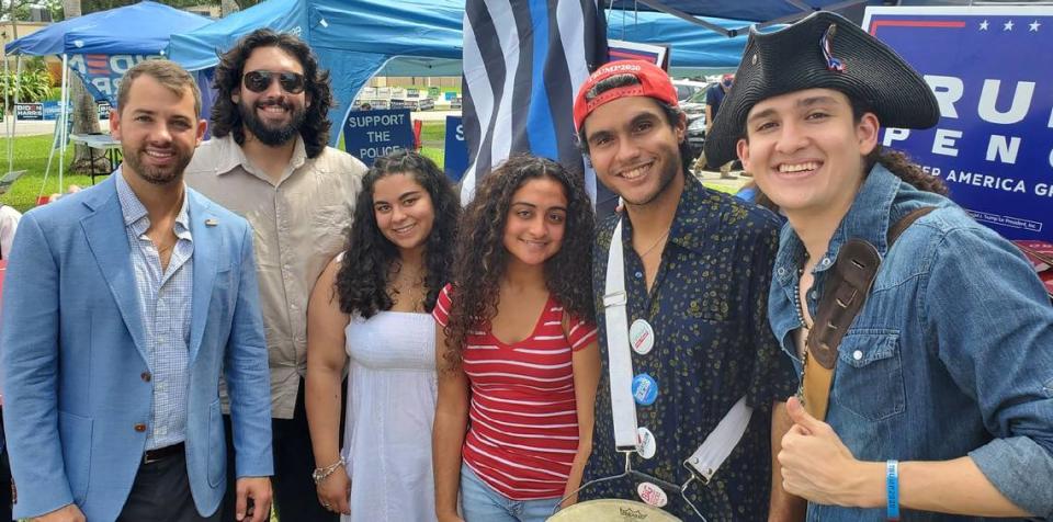 Federico Arango, second from left, campaigns with Vice President Mike Pence’s nephew, John Pence, left, at an event Thursday at the Westchester Regional Library. Next to Arango from left to right is Vanesa Rodriguez, AnaKarina Cabrera, Anthuan Rubbio-Uribe and Miguel Arango.