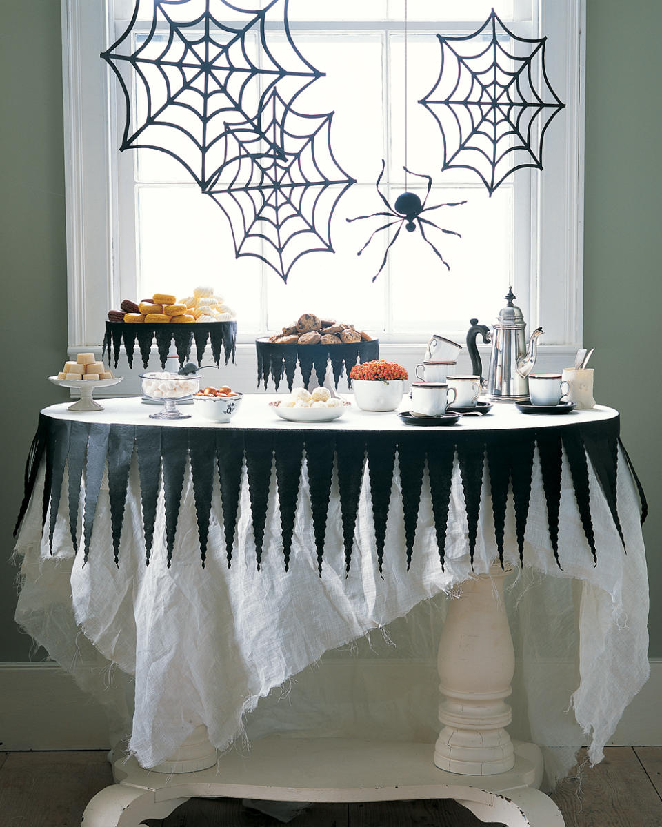 Tattered Tablecloth and Spider Webs