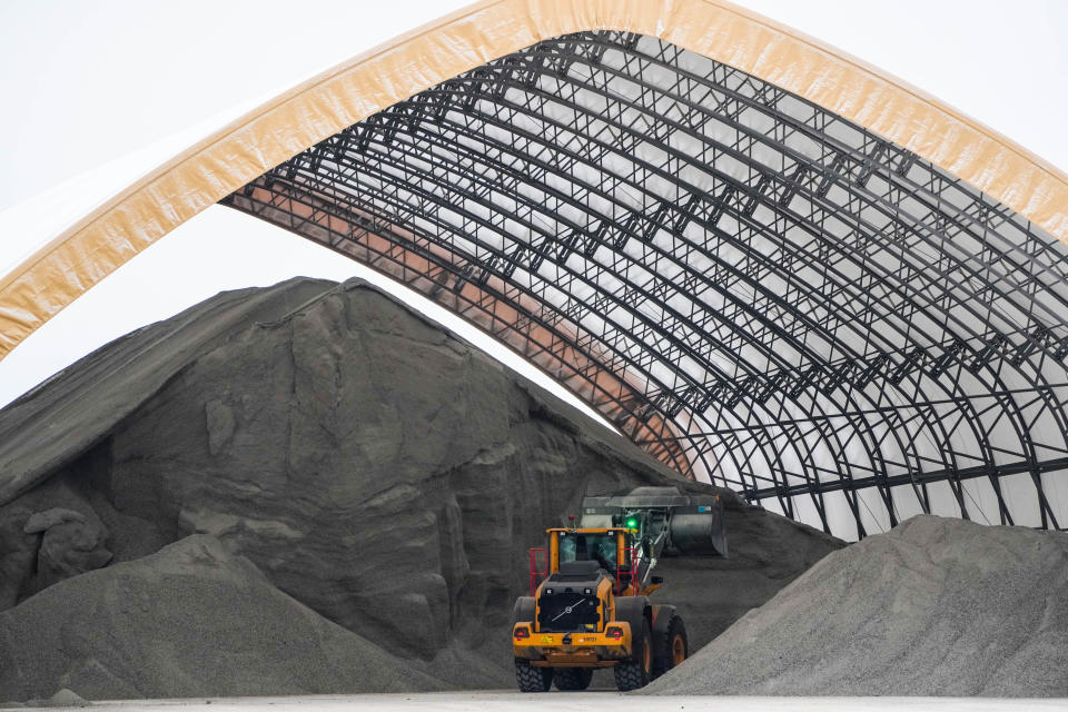 Sand is readied at the city of Des Moines public works lot Wednesday as the blizzard approaches.