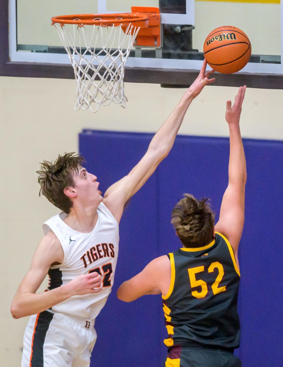 Illini Bluffs' Hank Alvey, left, blocks a shot by ROWVA/Williamsfield's Graham Wight during their ICAC Tournament semifinal Thursday, Jan. 12, 2023 at Peoria Christian High School in Peoria. The Tigers advanced to the Saturday title game with a 61-34 victory over the Cougars.