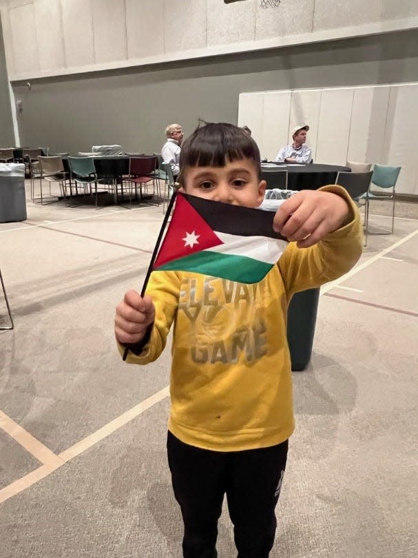 A young member of Festa’s 3-Generation Family ESL Program, which runs during the school year at sites in Hilliard and Dublin, shares his pride in his family’s home country of Jordan.