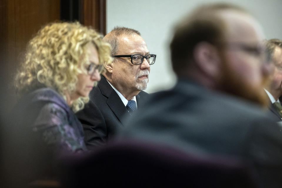 Greg McMichael sits with his attorney before the start of closing arguments to the jury during the trial of he, and his son Travis McMichael, and William "Roddie" Bryan, at the Glynn County Courthouse, Monday, Nov. 22, 2021, in Brunswick, Ga. The three men charged with the February 2020 slaying of 25-year-old Ahmaud Arbery. (AP Photo/Stephen B. Morton, Pool)