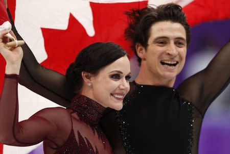 Figure Skating - Pyeongchang 2018 Winter Olympics - Ice Dance free dance competition final - Gangneung, South Korea - February 20, 2018 - Gold medallists Tessa Virtue and Scott Moir of Canada celebrate. REUTERS/John Sibley