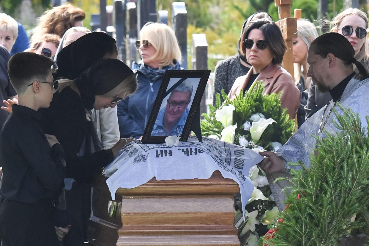 Relatives react by the coffin of Valery Chekalov (AFP via Getty Images)