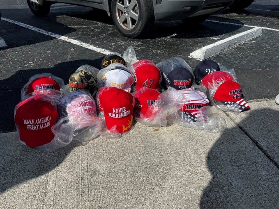 Ronald Solomon has Trump hats for sale outside the Alto Lee Adams Sr U.S. Courthouse while the former president is inside in a closed hearing about classified documents in his criminal case.