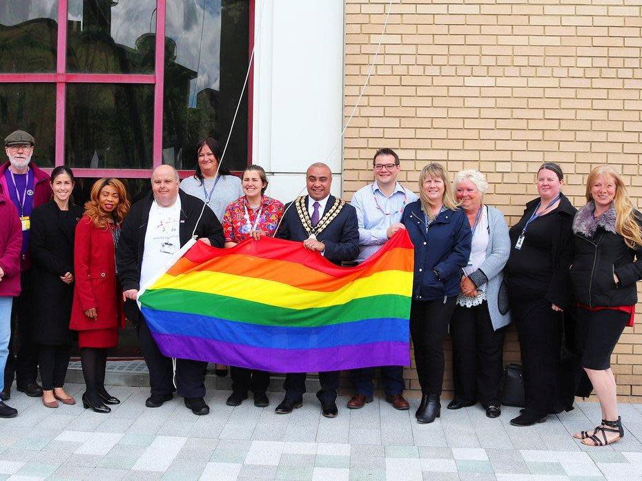 The newly elected mayor of Basildon was subjected to “outrageous” racist abuse while raising an LGBT\+ flag to kick off Pride celebrations.David Burton-Sampson, who identifies as “a gay, black man”, was targeted with racist chants of “Raise the f***ing flag n****r” by a group of six adults in the crowd at Basildon Council’s Essex office. The council reported the incident to its hate crime unit and to Essex Police on Friday afternoon, shortly after the incident. “It’s appalling, I’m lucky I’ve got tough skin,” Mr Burton-Sampson, 41, told The Southend Echo. “I’m hard to these things, but there are a number of those sorts of things that could really affect members of the community.”The mayor, who was elected in May 2019, saw a group of five or six men and women who were being loud and had wandered over to the flag-raising ceremony.He assumed they had been drinking, however did not hear what they were chanting until after the event.He said: “I was focusing on the speech, I wasn’t trying to follow what they were saying. I then heard the video and they were just repeating ‘Raise the f*****g flag n*****’ over and over.”Basildon Council uploaded the video to its Twitter page to celebrate Essex Pride weekend, but made the decision to mute the chants.> A proud moment but sadly with no sound as someone found it appropriate to shout racist abuse at me whilst I raised this symbol of equality and unity! https://t.co/kMjgLlXA5R> > — David Burton-Sampson - Mayor of Basildon Borough (@cllrdbs) > > June 14, 2019The Liverpudlian mayor continued: “It is very upsetting to hear. It doesn’t matter who you are, people think it’s acceptable to say those things in public in 2019 at an individual.”“I represent the borough and the people within it. I was raising a flag that represents the fight against hate and raises the awareness of inclusion and equality – it’s outrageous.”When the Labour Party councillor was elected Basildon’s mayor in May 2019, he told the Braintree and Witham Times: “I know and recognise the significance of a gay, black man being in this role.“I hope I serve as an example to other members of the LGBT+ community, those of different colours, creeds and religions, whatever your intersections if you focus, work hard and put your mind to it, anything is possible.”Gavin Callaghan, leader of Essex council, denounced those responsible for the earlier event on social media.He said: “Let’s be clear, hurling racist abuse at our mayor is totally unacceptable and we have reported this to the police.“But just a spoiler to the bigot who did it; you might not know Councillor Burton-Sampson, but I do, and it won’t work, he isn’t going to be deterred by a stone-cold loser like you.”Basildon Council confirmed the incident had been reported on Friday afternoon. A spokesperson said: “Basildon Council is a Hate Incident Reporting Centre, HIRCs, are community venues where individuals can report hate incidents and hate crimes, either as a victim or a witness.HIRCs act as an alternative place to report hate crimes rather than directly to the police, in a non-emergency situation.Essex Pride was established in 2003. This year saw Essex Police adorn their uniforms with rainbow epaulettes for the first time, in support of the event.During the weekend, a “thoroughly vile” Colchester man was charged with at least three hate crime and public order offences. This came after police officers received a torrent of homophobic abuse while attending an incident on Friday evening involving an alleged assault and racial abuse, Essex Live reports.PC Mark Jones of Essex Police wrote on Twitter of the arrest: “These people still exist, but we deal with them.” Additional reporting by SWNS