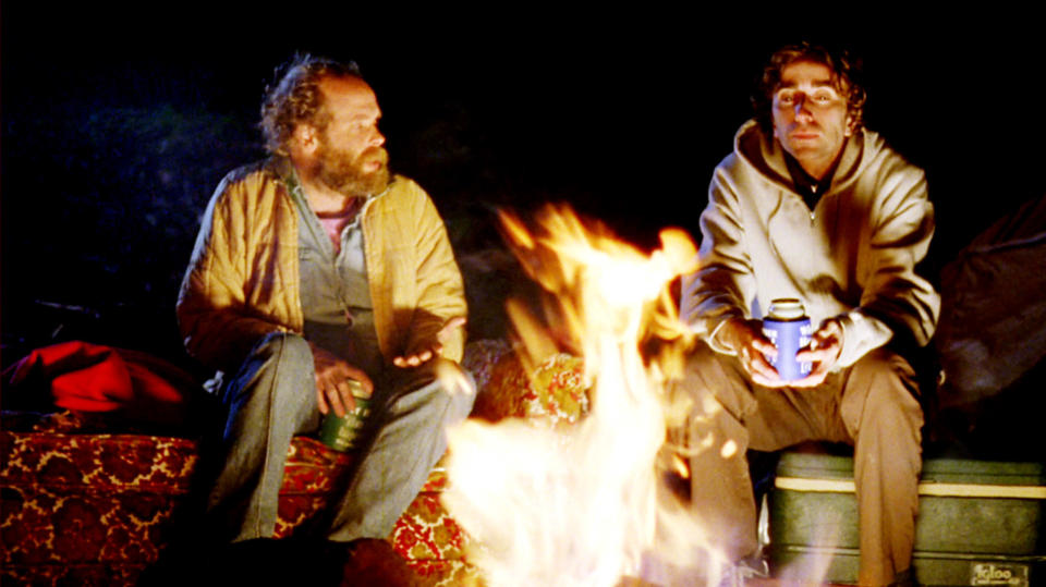 Will Oldham and Daniel London sit by a fire