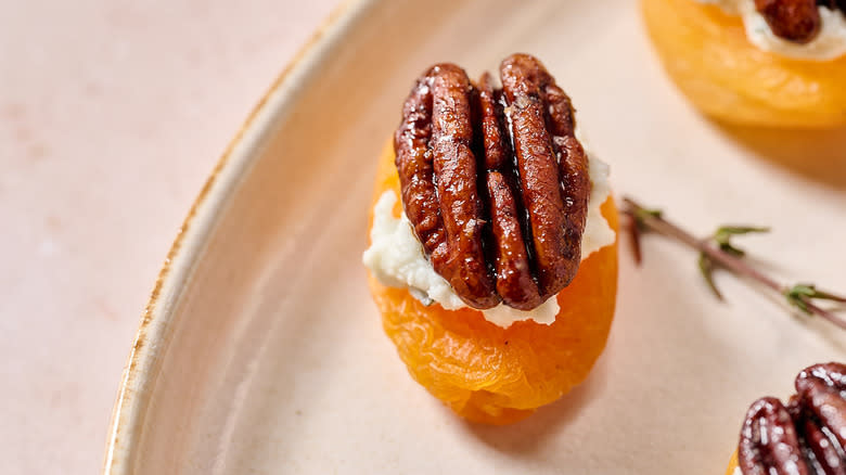 candied pecan on top of apricot