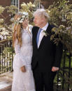 In this image released Sunday May 30, 2021, by Downing Street, Britain's Prime Minister Boris Johnson and Carrie Johnson pose together for a photo in the garden of 10 Downing Street after their wedding on Saturday. Boris Johnson and his fiancée Carrie Symonds are newlyweds, according to an announcement from his Downing Street office saying they were married Saturday May 29, in a small private ceremony in London. (Rebecca Fulton/Downing Street via AP)
