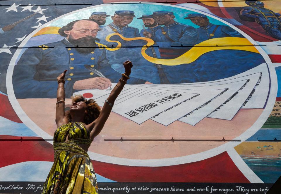 Dancer Prescylia Mae, of Houston, performs during a dedication ceremony for the massive mural “Absolute Equality” in downtown Galveston, Texas, during last year’s Juneteenth celebrations. It was in Galveston that the news of emancipation reached Texas on June 19, 1965 – two and a half years after President Lincoln had signed the Emancipation Proclamation.