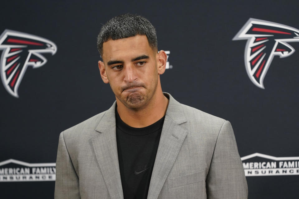 Atlanta Falcons quarterback Marcus Mariota (1) pauses before answering questions during a news conference at the end of an NFL football game against the Washington Commanders, Sunday, Nov. 27, 2022, in Landover, Md. Washington won 13-19. (AP Photo/Patrick Semansky)