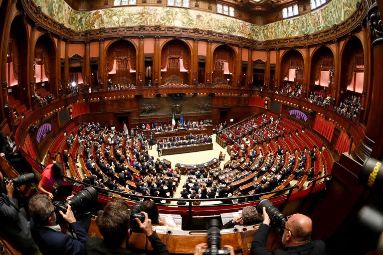 Italian Members of Parliament listen to the new Prime Minister Giorgia Meloni speaking during her first address to parliament ahead of a confidence vote at Montecitirio palace in Rome on October 25, 2022. - Meloni said that Italy would "continue to be a reliable partner of NATO in supporting Ukraine", amid concerns over the pro-Russian stance of her coalition partners. (Photo by Andreas SOLARO / AFP)