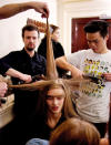 A model gets her hair styled backstage at LFW © Getty