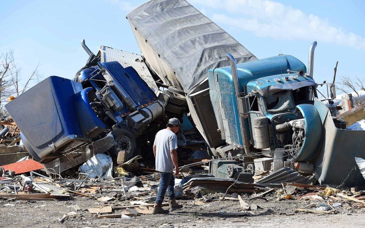 Abel Hernandez of Leland looks over tornado damage in Rolling Fork, Mississippi - CHRIS TODD/EPA-EFE/Shutterstock