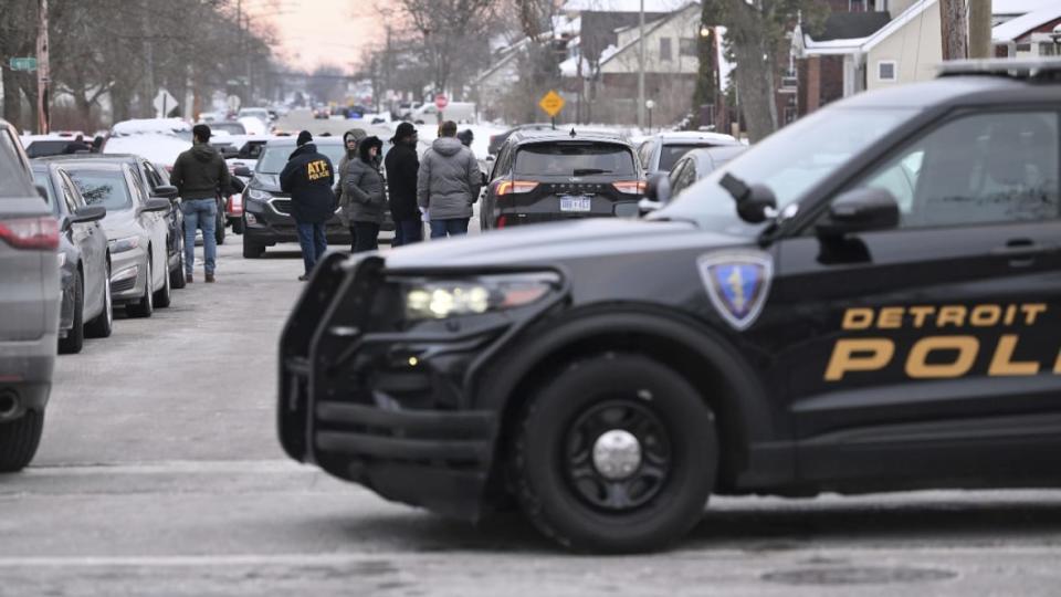 Officials from the Detroit Police Department, Michigan State Police and federal ATF Bureau worked the scene in Detroit near Highland Park last month after three men were found shot to death. Authorities said the men, three aspiring rappers reported missing nearly two weeks earlier, were victims of gang violence. (Photo: Robin Buckson/Detroit News via AP)