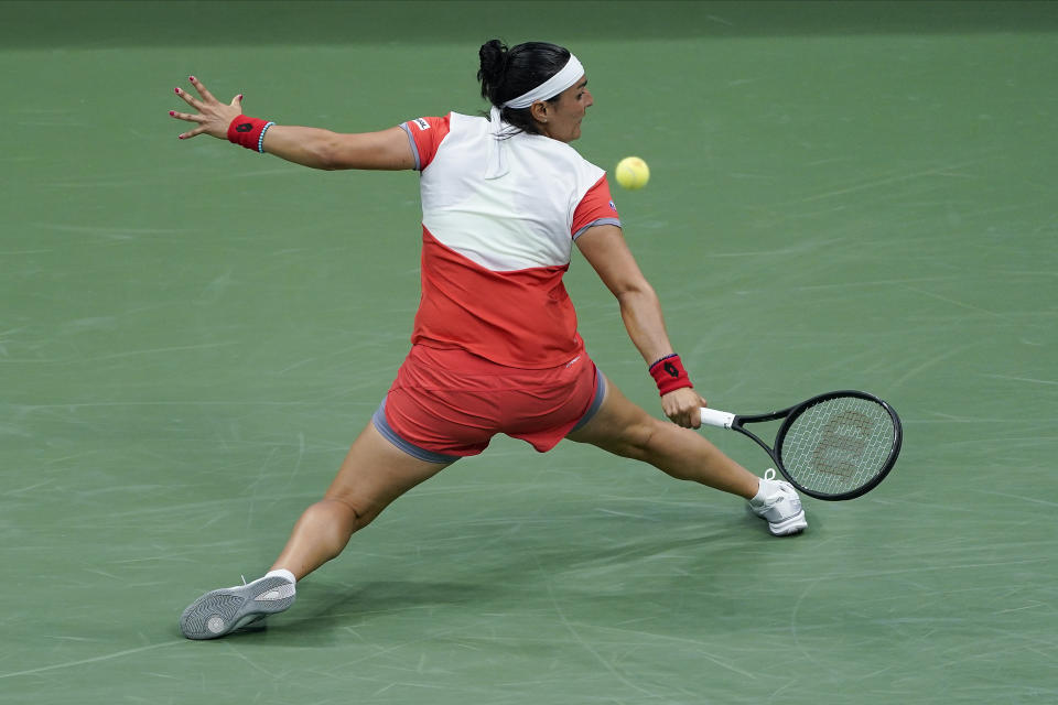 Ons Jabeur, of Tunisia, returns a shot to Ajla Tomljanovic, of Austrailia, during the quarterfinals of the U.S. Open tennis championships, Tuesday, Sept. 6, 2022, in New York. (AP Photo/Seth Wenig)