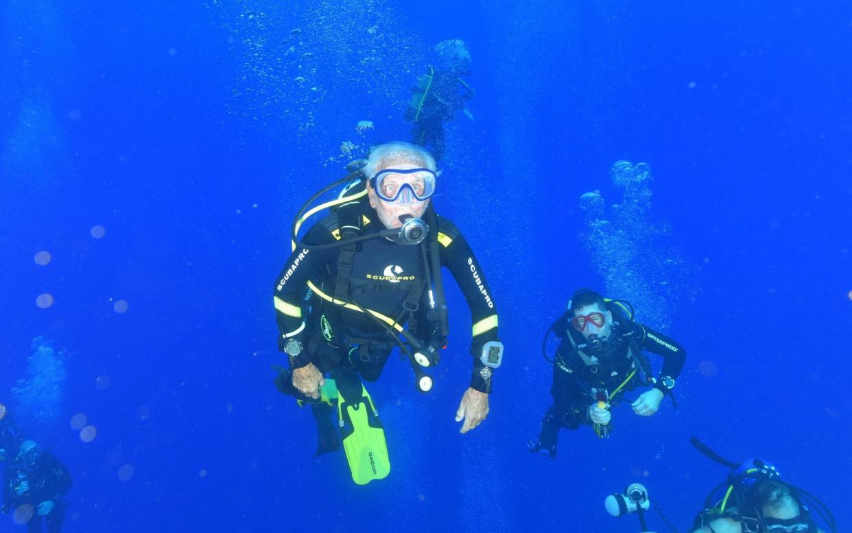 Ray Woolley, a Second World War veteran, sets new record as he swims over the wreck of the MS Zenobia at the age of 95 - REUTERS