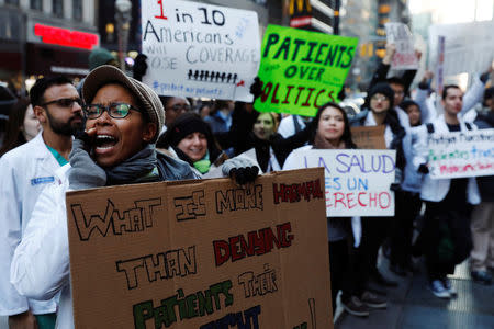 Demonstrators that include mostly medical students protest a proposed repeal of the Affordable Care Act in New York, U.S., January 30, 2017. REUTERS/Lucas Jackson