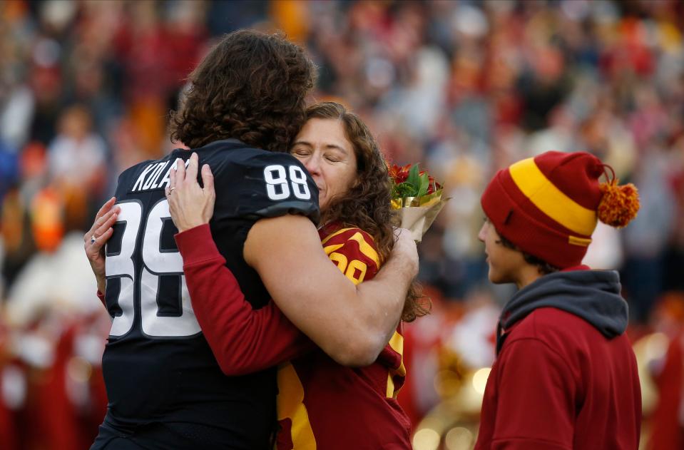 Charlie Kolar hugs his mom, Maria, during Senior Day ceremonies at Jack Trice Stadium. Tuesday, Kolar won the prestigious Campbell Trophy that recognizes greatness both on and off the field.