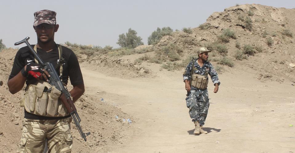 Iraqi security forces and volunteers take part in a mission to secure an area from militants of the Islamic State, formerly known as the Islamic State in Iraq and the Levant (ISIL), in Udhaim district, north of Baghdad, August 6, 2014. Iraqi forces said they were fully in control of a district, northeast of Baghdad, after repelling repeated attacks by insurgents of the Islamic State to capture the area and continue their push towards the capital. Picture taken August 6, 2014. REUTERS/Stringer (IRAQ - Tags: CIVIL UNREST POLITICS CONFLICT MILITARY)