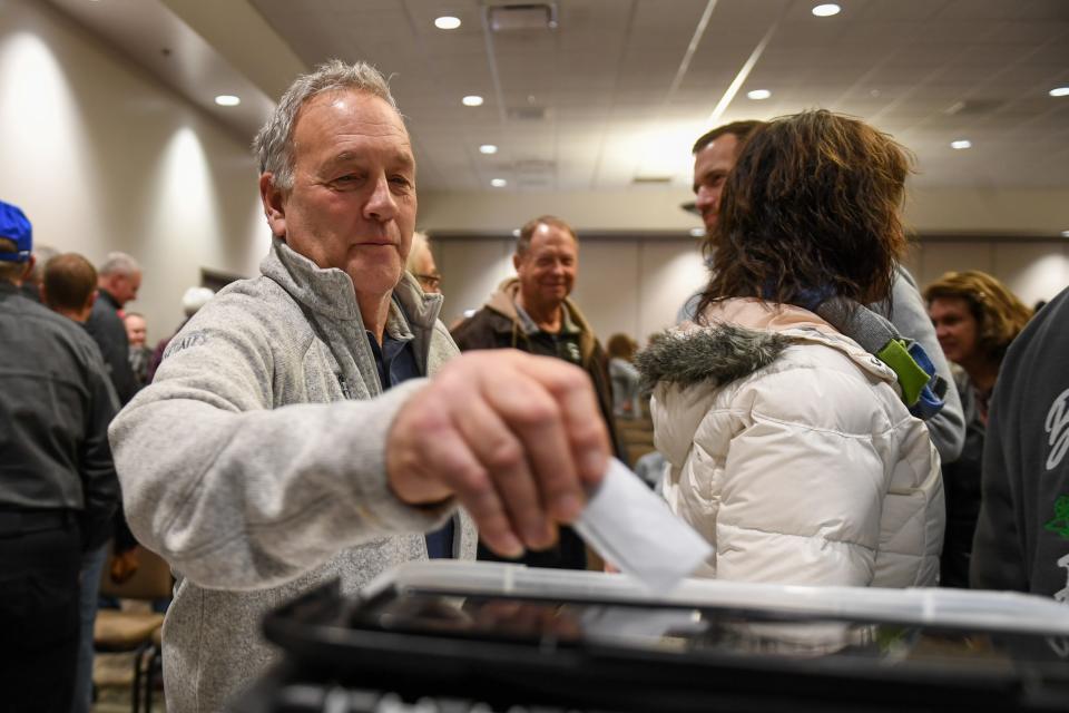 Caucus goers turn in their vote for the Iowa caucus on Monday, Jan. 15, 2024 at Terrance View Event Center in Sioux Center, Iowa.