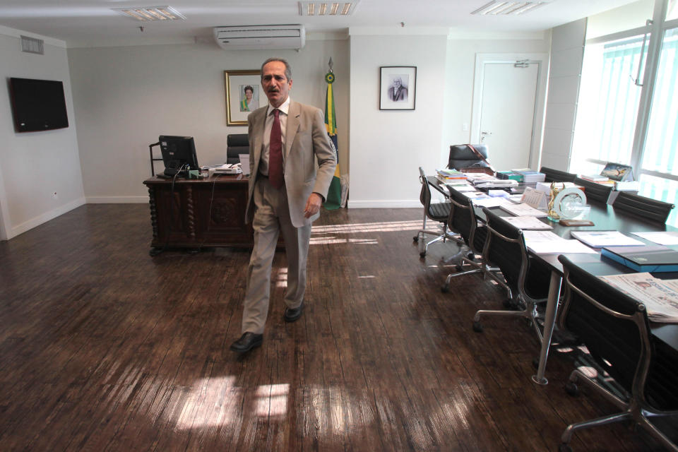 Brazil's Sports Minister Aldo Rebelo walks in his office before an interview in Brasilia, Brazil, Thursday March 22, 2012. A government watchdog group is warning Brazilian authorities that planning delays could compromise the 2014 World Cup. Rebelo downplayed delays in Brazil's preparations Thursday, saying that everything will be ready in time. (AP Photo/Eraldo Peres)