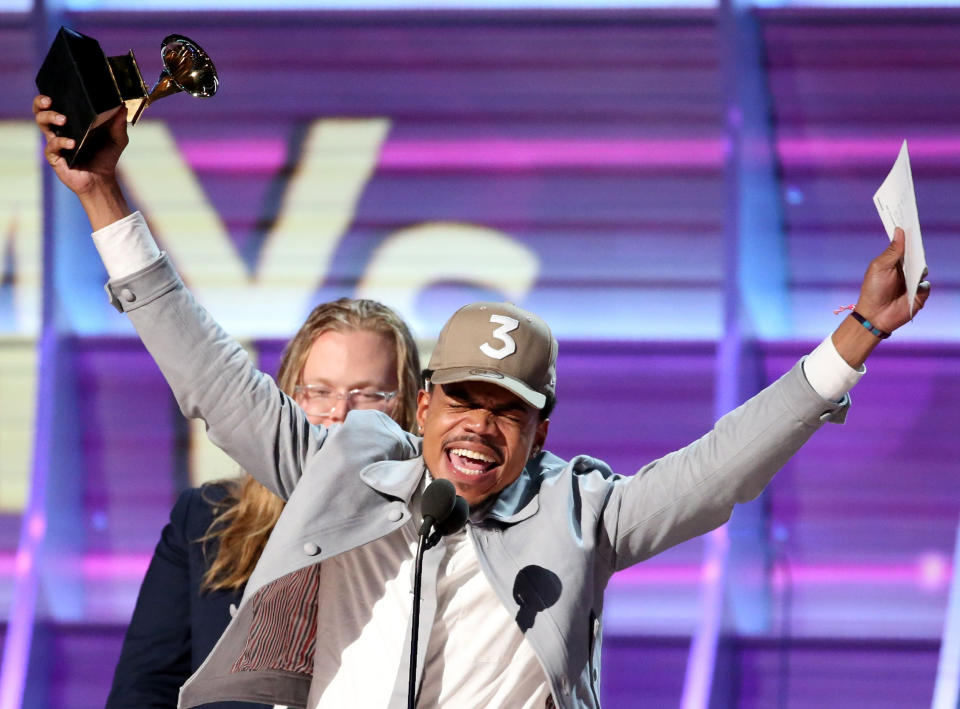 Image: Chance the Rapper celebrates as he accepts the Grammy for Best Rap Album for 