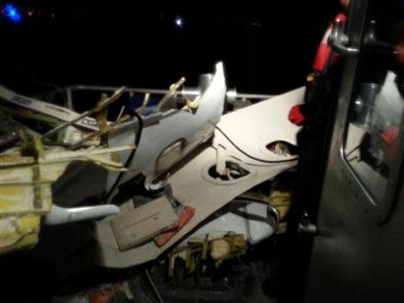 The wreckage of a plane that crashed into the Atlantic Ocean is brought aboard a U.S. Coast Guard boat off the coast of Fort Lauderdale, Florida November 19, 2013. REUTERS/U.S. Coast Guard/Handout