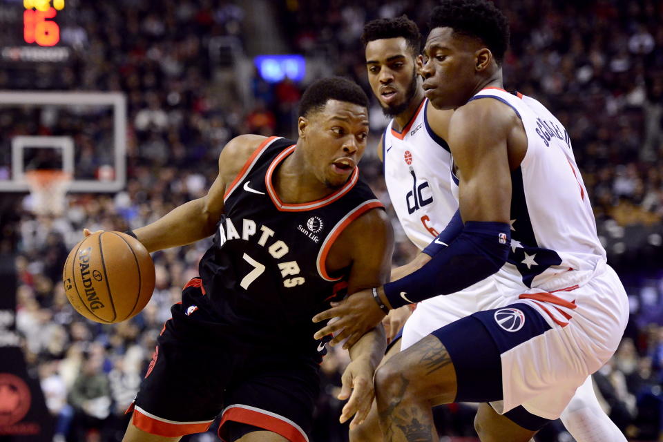 Toronto Raptors guard Kyle Lowry (7) drives to the net past Washington Wizards guard Admiral Schofield, right, during the first half of an NBA basketball game Friday, Dec. 20, 2019, in Toronto. (Frank Gunn/The Canadian Press via AP)